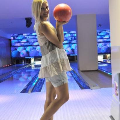 Stag girl attracted in playing bowling